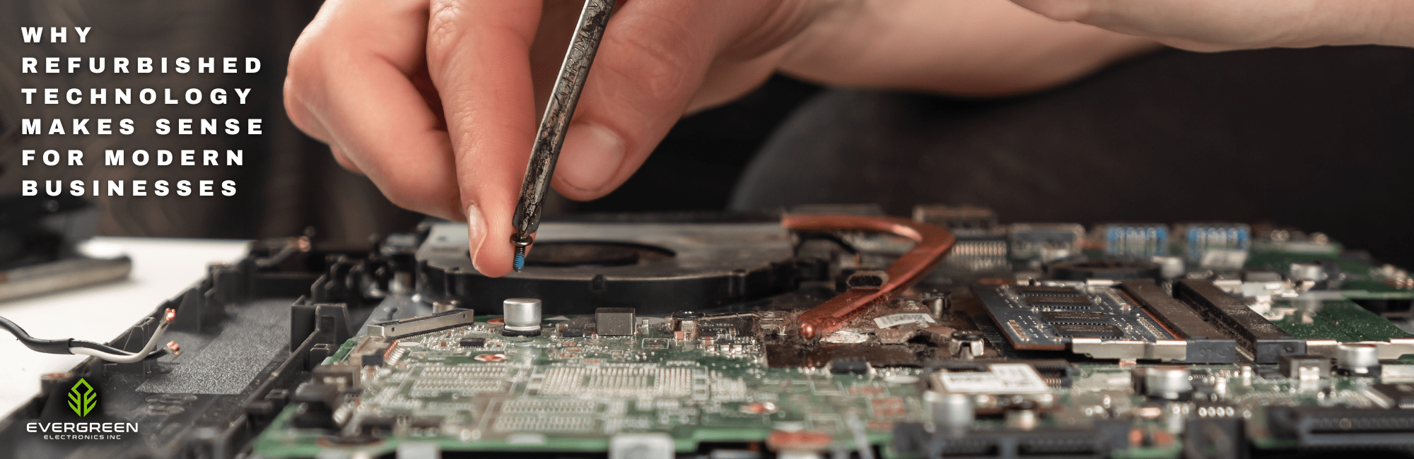 Technician repairing a laptop motherboard with a screwdriver, highlighting the refurbishment process for business-grade technology.